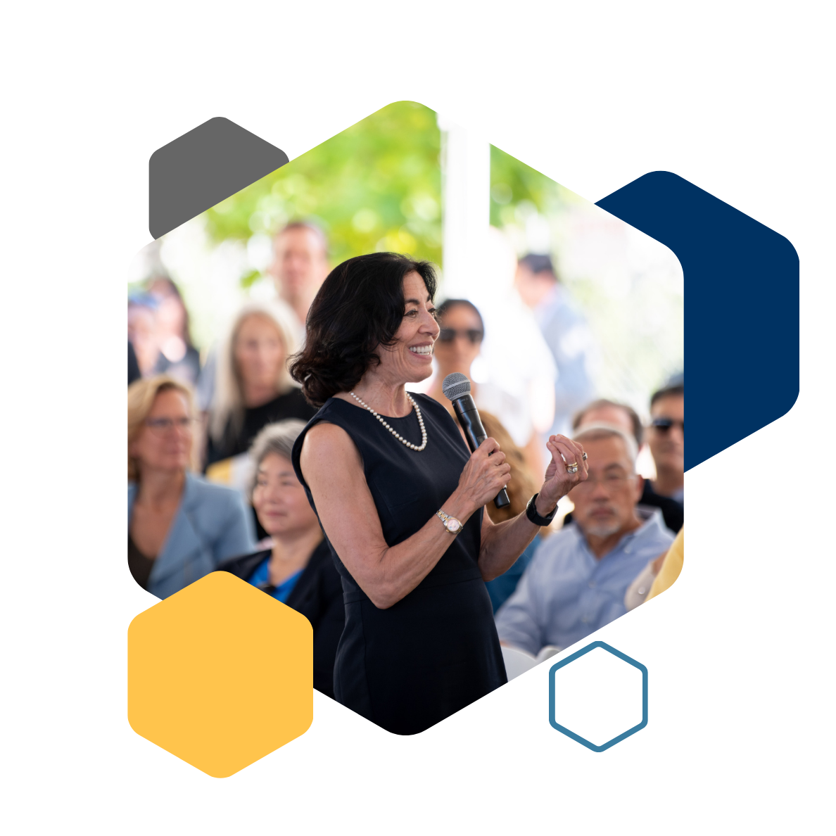 Jennifer Chayes leading an event, blue, yellow, and gray tessellation 