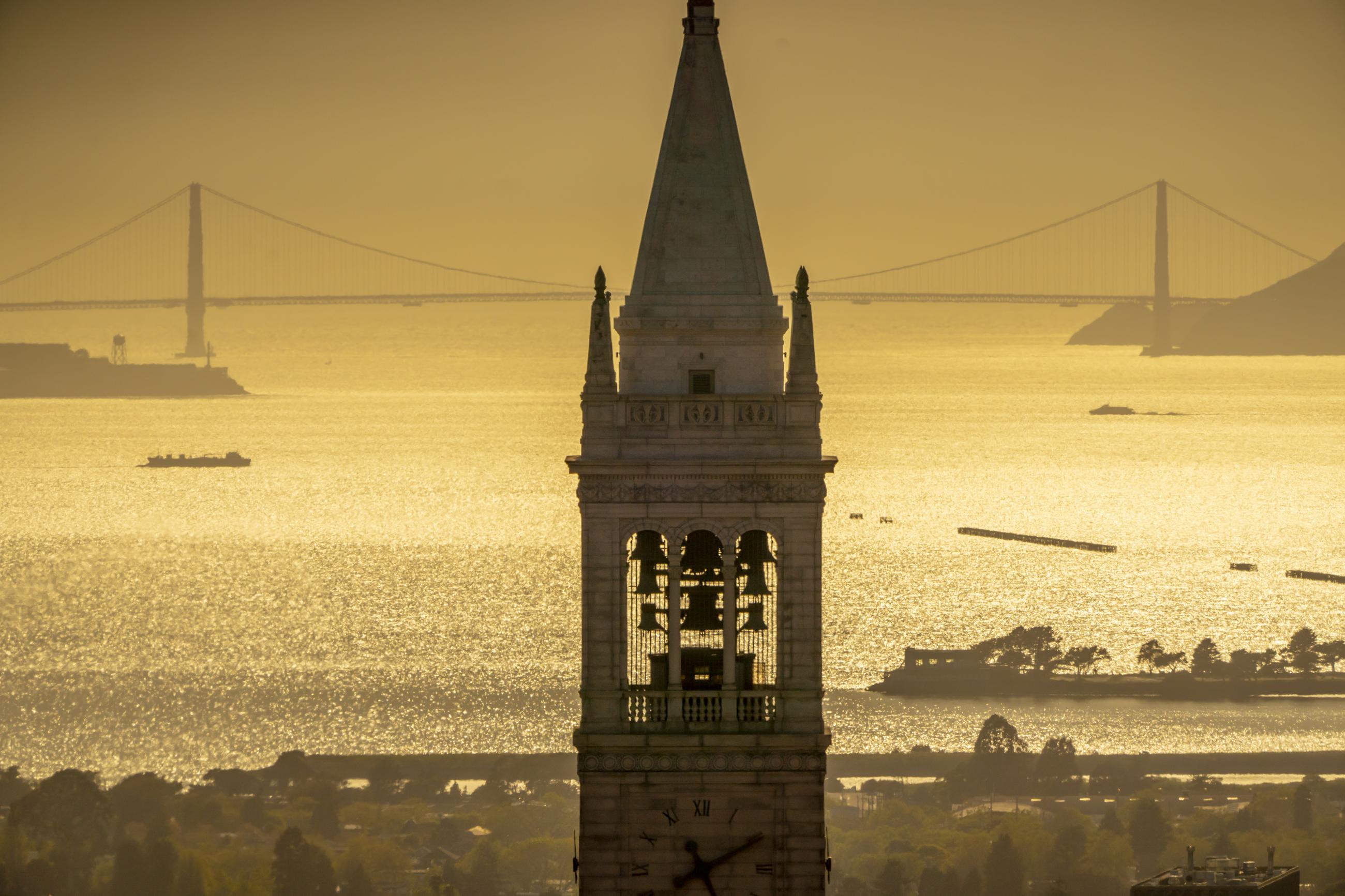 UC Berkeley's Campanile with a golden sunrise over the bay in the background. (Photo /Adam Lau)