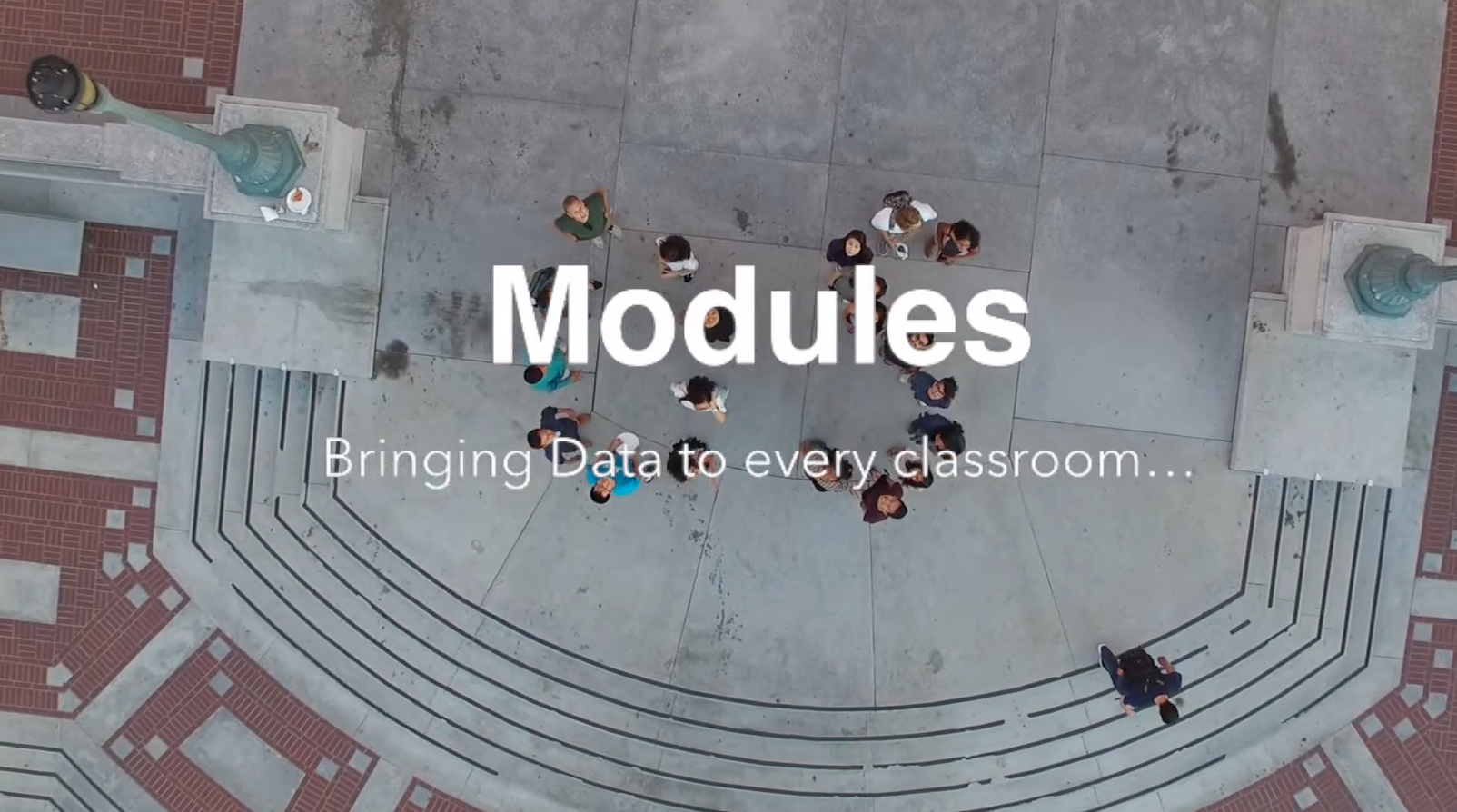 Overhead shot of open space and stairs with the text "Modules: Bringing data to every classroom"